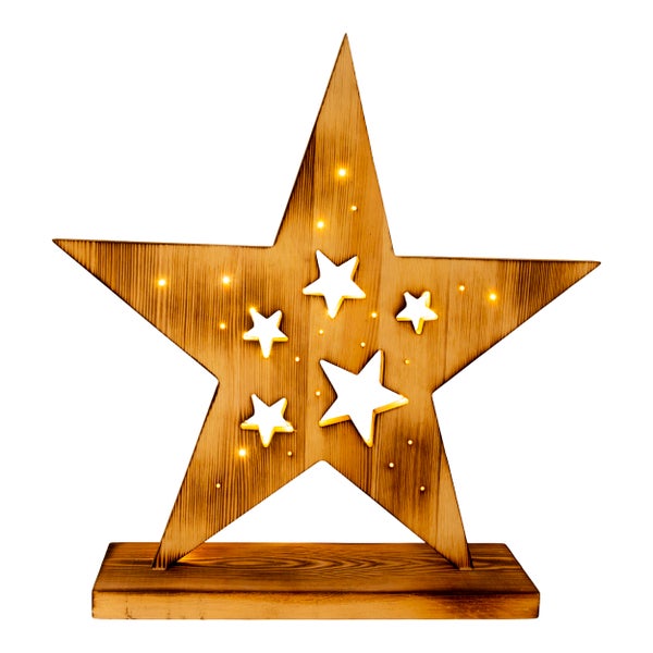 Dekorativer Holzstern mit Sternausschnitten und Beleuchtung auf Holzsockel