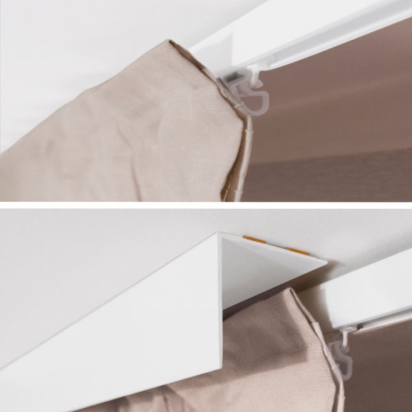 Detailaufnahme einer Gardinenstange mit Gardine und Blende