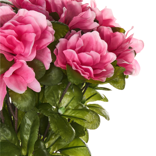 Kunstblumenarrangement mit rosa Blüten und grünen Blättern