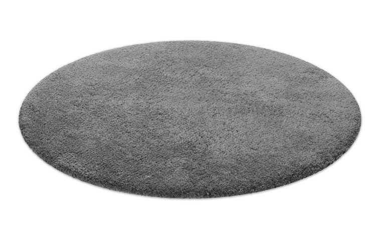 Runder grauer Langflor-Teppich in Hochflor-Optik.