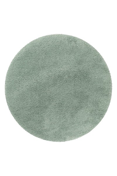 Runder Hochflor-Teppich in Salbeigrün mit weicher Oberfläche.