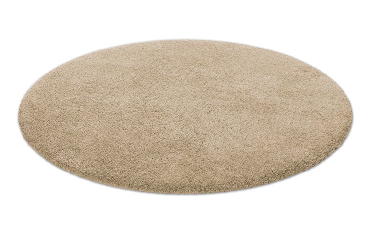 Runder Hochflor-Teppich mit weicher, zotteliger Oberfläche.