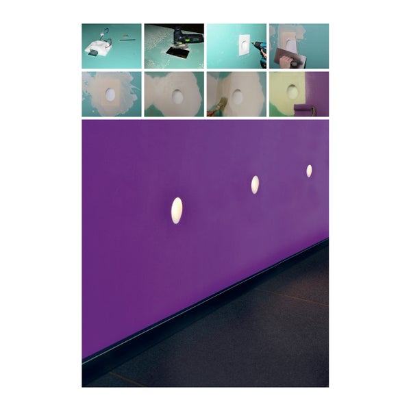 Wand mit eingelassenen Leuchten und Bodenleiste