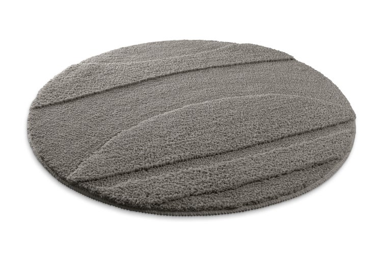 Runder grauer Badeteppich mit strukturiertem Blattmuster.