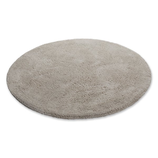 Runder Hochflor-Teppich in Beige aus weichem Material.