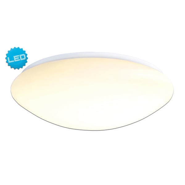 Dekorative Szene mit Solarleuchte, Kürbissen und Herbstblumen auf einem Holztisch