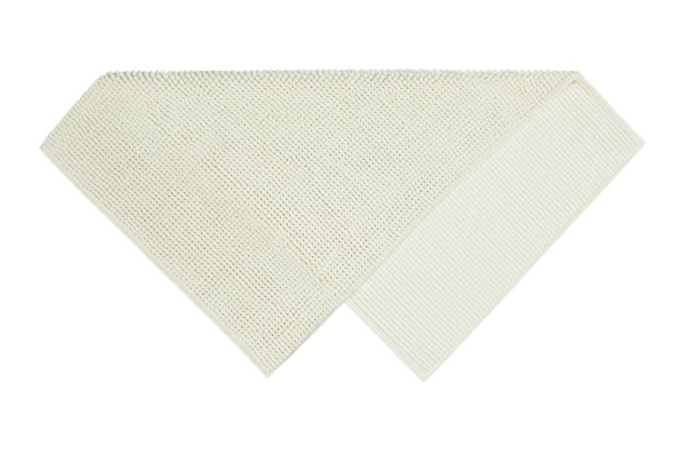 Chenille-Badematte in Creme mit weicher Noppen-Struktur und rutschhemmender Unterseite.