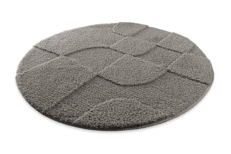 Runder Badteppich mit strukturiertem geometrischem Muster und weicher Oberfläche.