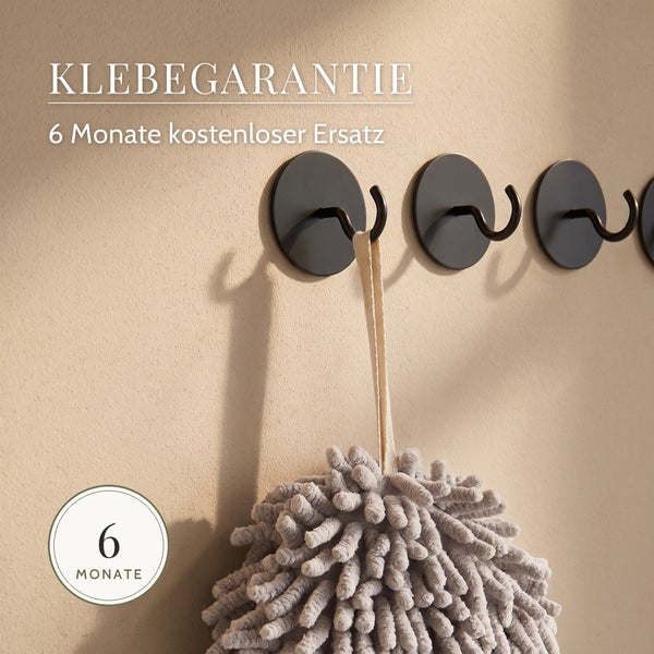 Wandhaken mit Klebegarantie und sechs Monaten Ersatzgarantie an der Wand montiert