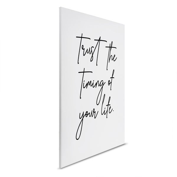 Dekorative Leinwand mit dem Spruch Vertraue dem Timing deines Lebens.