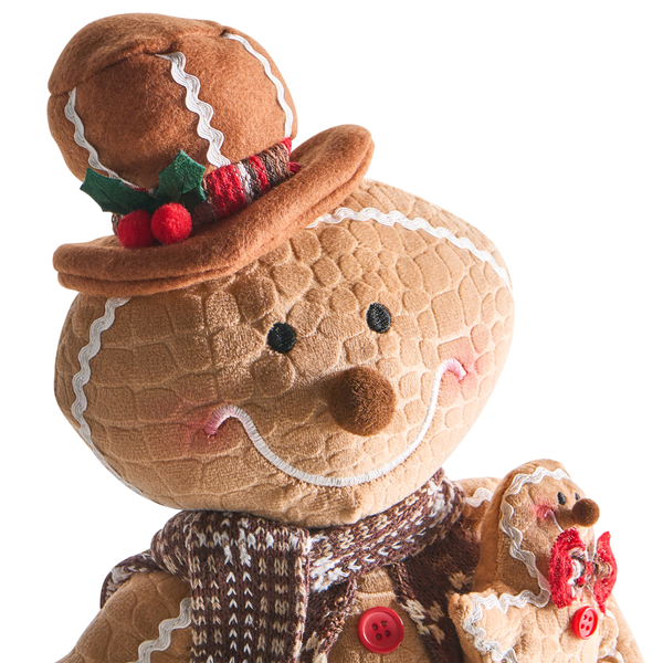 Lebkuchenmann als Weihnachtsdekoration mit Hut und Schal