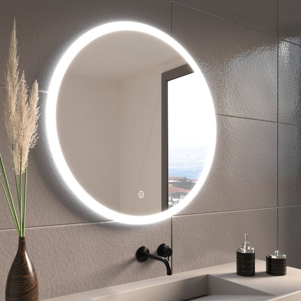 Runder Badezimmerspiegel mit LED Beleuchtung und Touch Schalter, montiert über einem modernen Waschbecken mit Armatur.