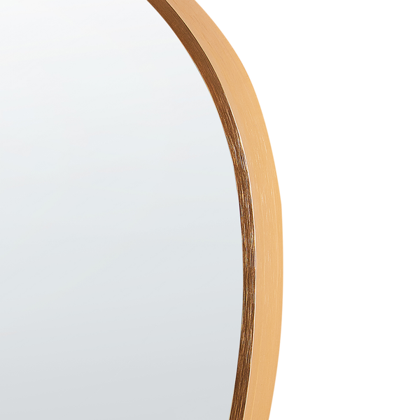 Detailansicht eines runden Spiegels mit goldfarbenem Metallrahmen.