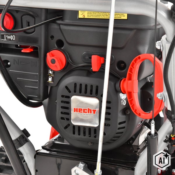 Detailansicht des Benzinmotors einer Hecht Schneefräse mit Startergriff und Bedienelementen