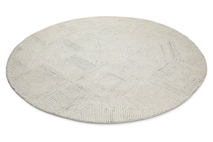 Runder Teppich mit geometrischem Rautenmuster und strukturierter Oberfläche.