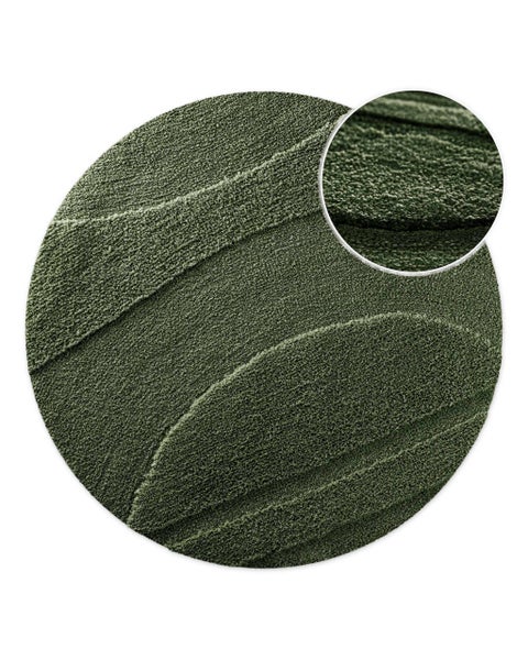 Runder Hochflor Teppich mit modernem Relief Muster und Detailansicht der Textur.