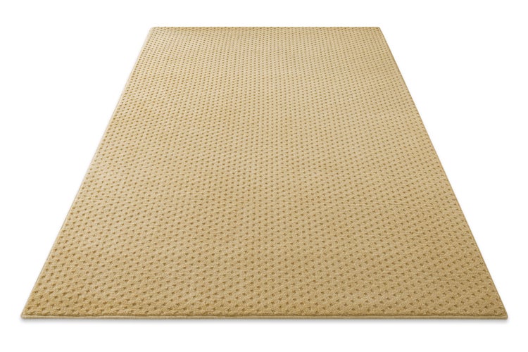 Beigefarbener rechteckiger Teppich mit feinem geometrischem Punktmuster.