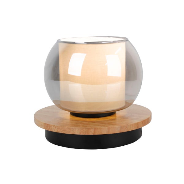 Tischleuchte mit Holzfuß und kugelförmigem Glasschirm