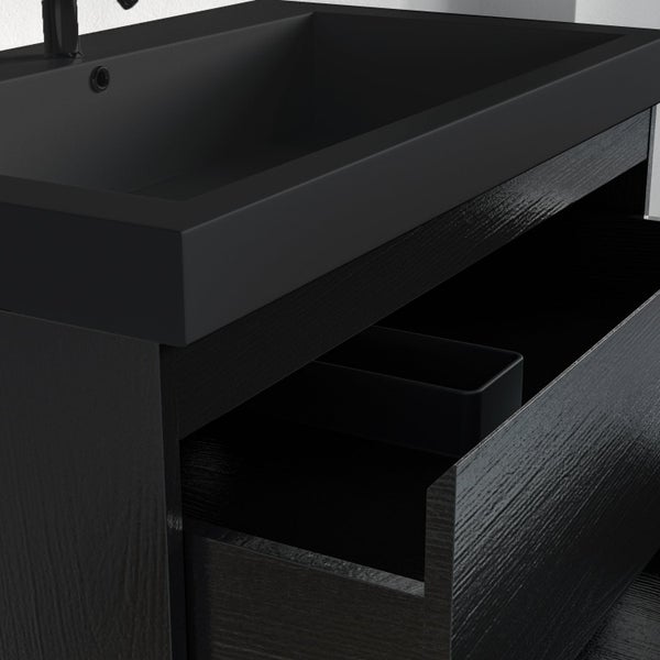 Moderner Waschtisch mit rechteckigem Waschbecken und Unterschrank in dunkler Holzoptik mit geöffneter Schublade.