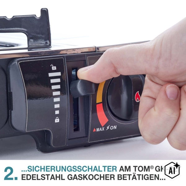 Hand bedient den Sicherungsschalter an einem TOM Gaskocher GK 227 zur Verriegelung der Gaskartusche.