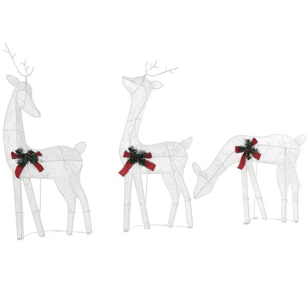 Drei leuchtende Rentiere als Weihnachtsdekoration