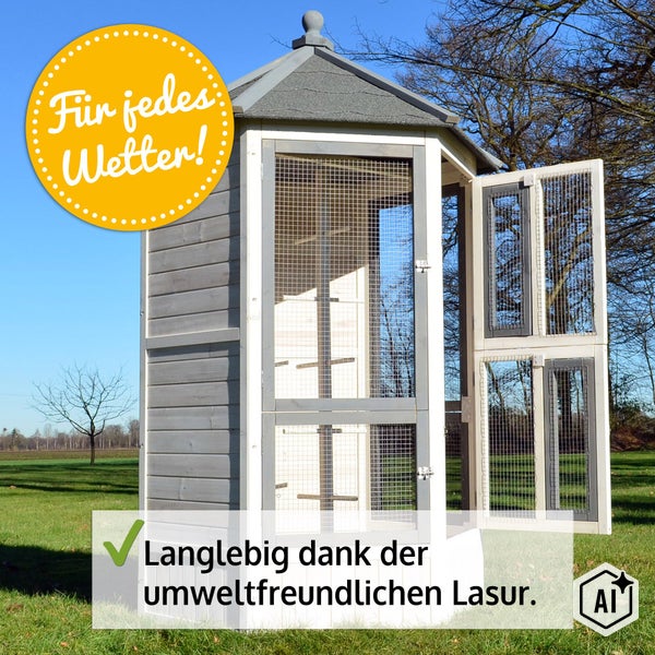 Große Vogelvoliere aus Holz mit Gittertüren, schützendem Dach und wetterfester Lasur für die Außenhaltung.