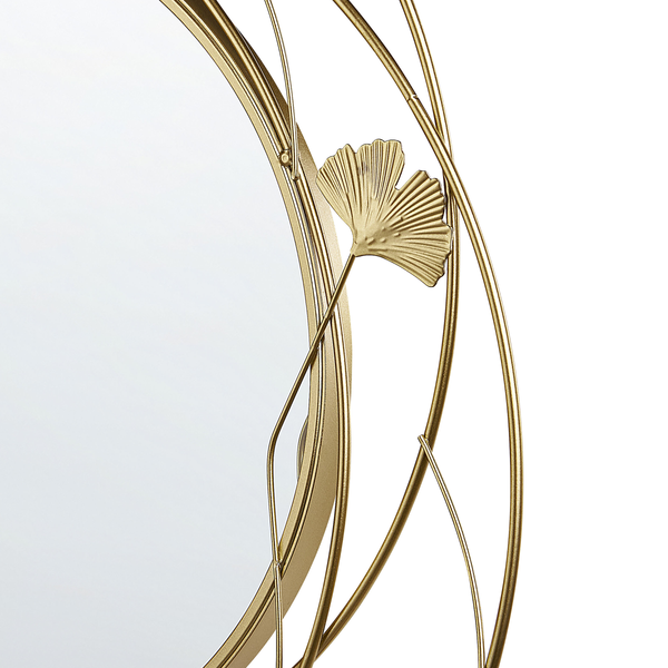 Detailansicht eines runden Wandspiegels mit dekorativem Ginkgo-Blatt