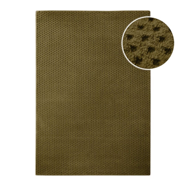 Rechteckiger Teppich mit strukturierter Oberfläche und kreisförmiger Detailansicht der Materialstruktur.