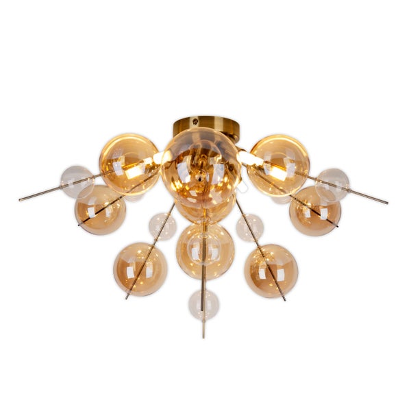 Moderne Pendelleuchte mit mehreren Glaskugeln und goldenen Elementen.