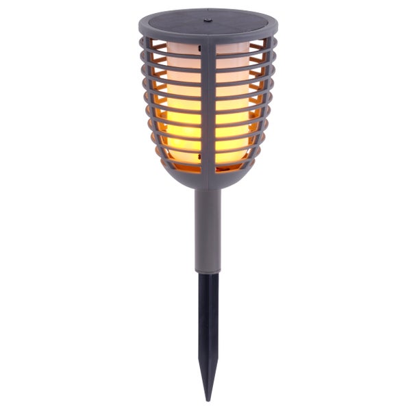 Solarlampe mit Flammeneffekt für den Außenbereich auf einem Holztisch