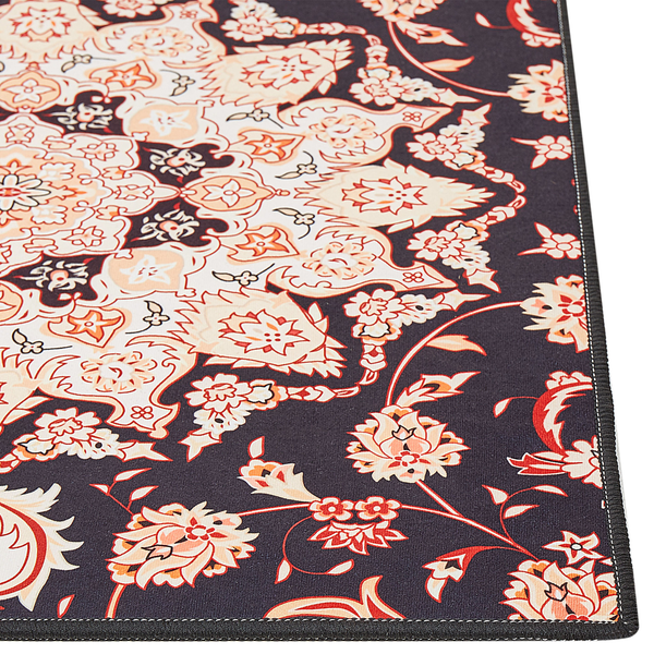 Teppich mit floralem Orient-Muster in Schwarz, Beige und Orange.