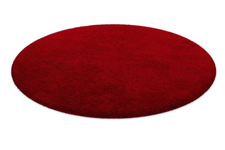 Runder Hochflor-Teppich in Rot.