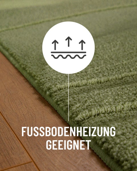 Materialhinweis 100 Prozent Polyester auf einer strukturierten Teppichoberfläche mit dekorativer Froschfigur und Herzsymbol.