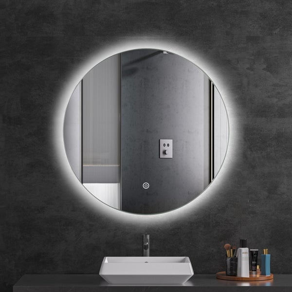 Runder Badezimmerspiegel mit integrierter LED Beleuchtung und Touch Sensor über einem Waschbecken in modernem Badezimmer Ambiente