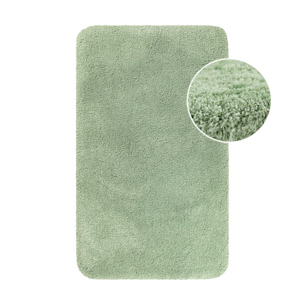 Badematte in Salbeigrün mit Hochflor und abgerundeten Ecken sowie Detailansicht der weichen Textur.