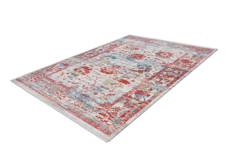 Rechteckiger Teppich mit orientalischen Ornamenten in Rot, Blau und Grau im Vintage-Stil.