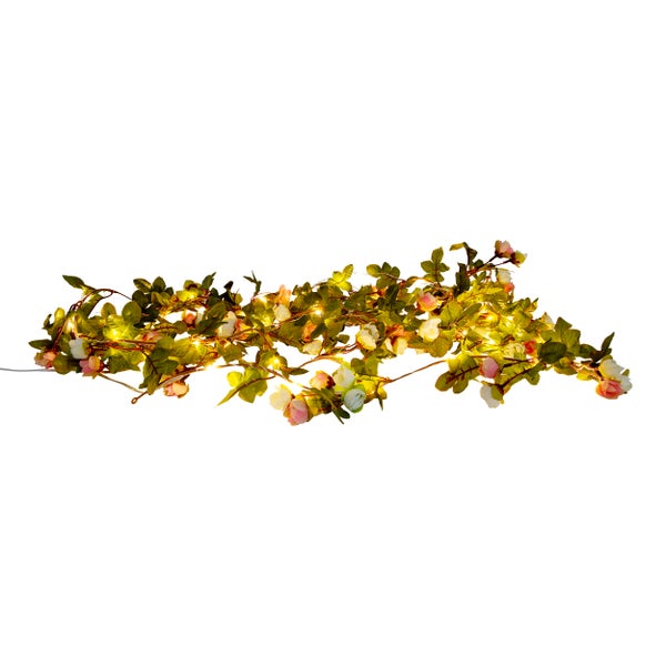 Dekorative Lichterkette mit Rosen und Blättern