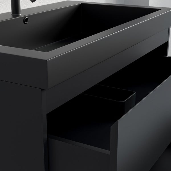 Waschtischunterschrank mit integriertem eckigem Waschbecken und geöffneter Schublade zur Aufbewahrung.