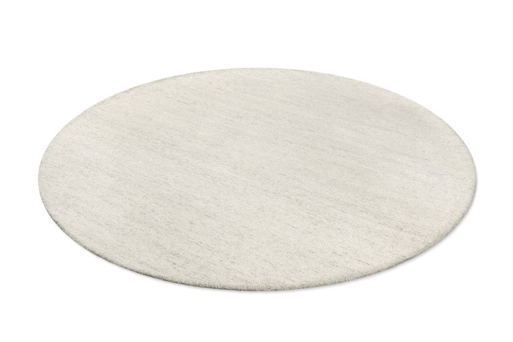 Runder, weicher Teppich in Creme.
