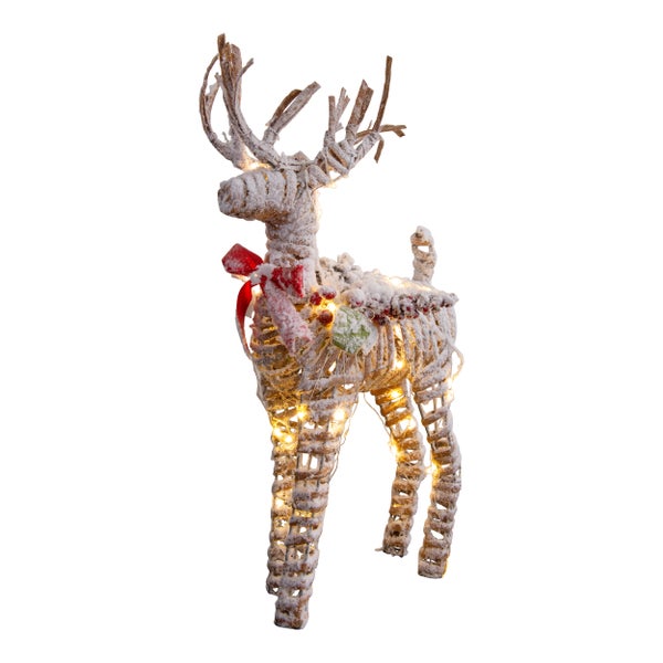Dekorativer leuchtender Rentier aus Rattan mit Schleife als Weihnachtsdekoration