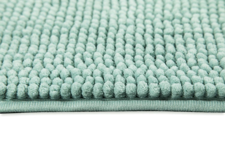 Badematte aus Chenille mit Noppenstruktur und eingefasstem Rand.