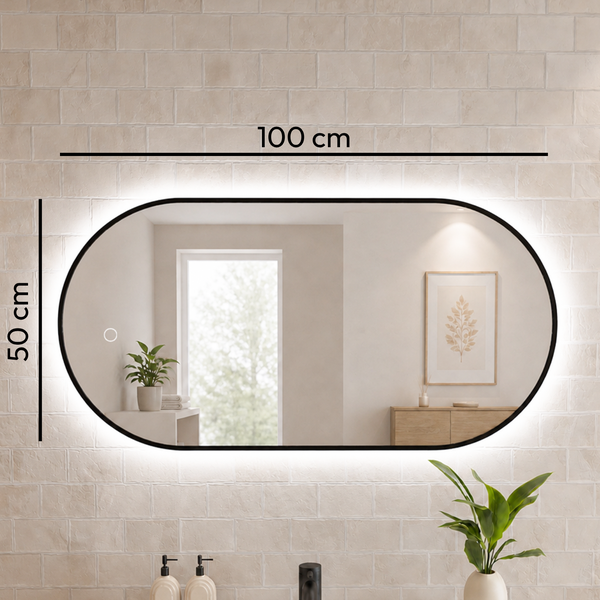 Ovaler Badezimmerspiegel mit LED Beleuchtung, Abmessungen 100 cm mal 50 cm, mit integriertem Touchschalter, montiert an einer Fliesenwand.