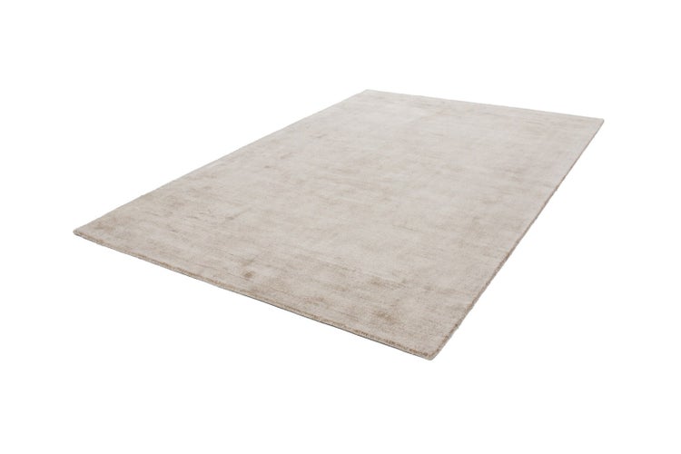 Rechteckiger Teppich in Beige mit weicher Textur.