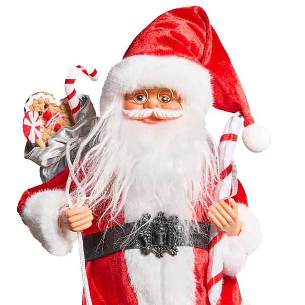 Dekorative Weihnachtsmannfigur mit Süßigkeiten und Geschenkesack