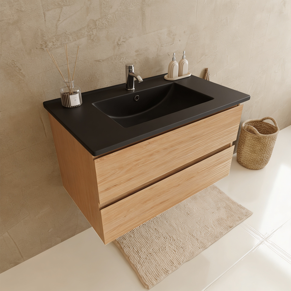 Moderner Waschtisch mit schwarzem Waschbecken und Unterschrank in Eichenoptik mit zwei Schubladen.