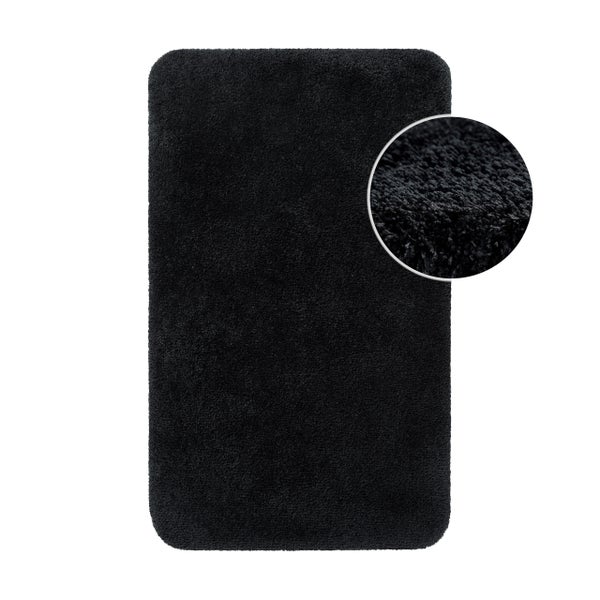 Badematte in Schwarz, rechteckig mit abgerundeten Ecken, weiche und flauschige Oberfläche.