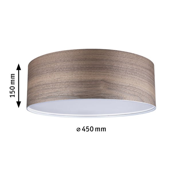Wohnzimmer mit Sitzgelegenheiten, Tisch, Regalen und Beleuchtung für eine gemütliche Atmosphäre