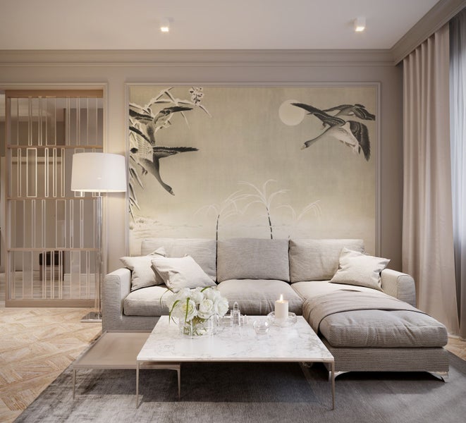 Wohnzimmer mit Sofa, Couchtisch und Wandbild mit Vogelmotiv.