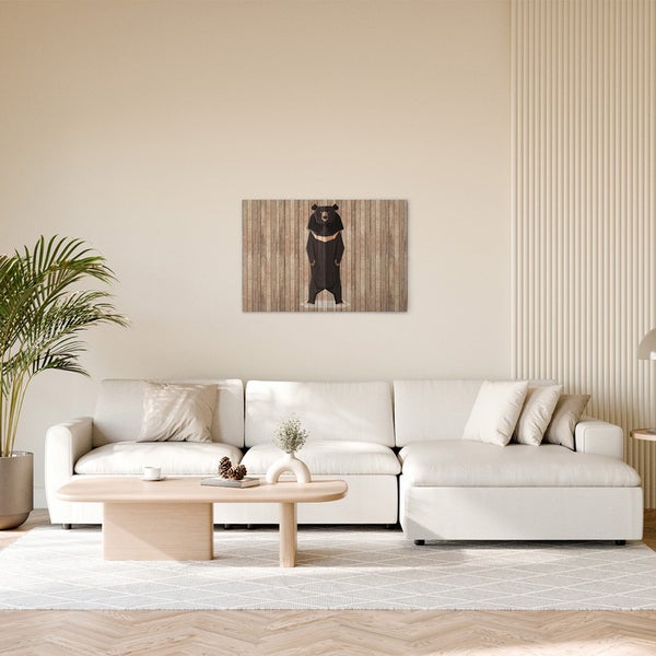 Wohnzimmer mit einem Bärenbild an der Wand