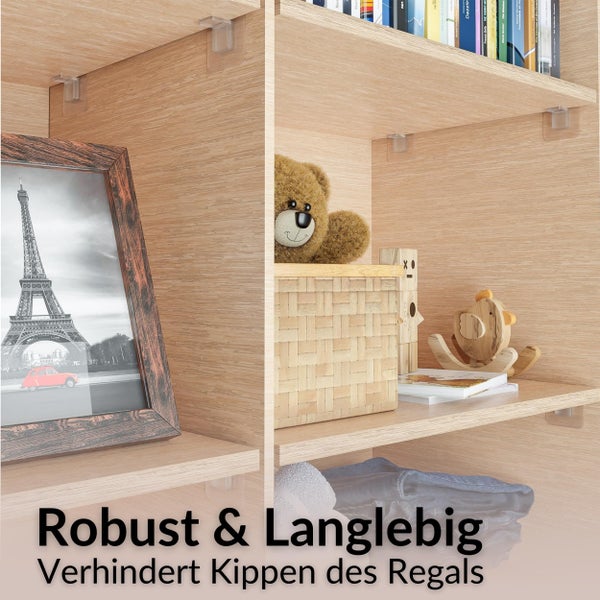 Transparente Möbelwinkel zur Sicherung von Holzregalen gegen Kippen, montiert in einem Regal mit Büchern, Spielzeug und einem Bilderrahmen.